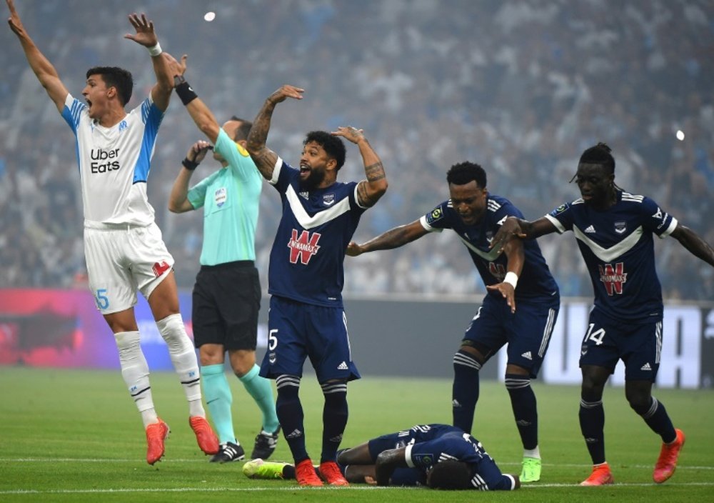 Samuel Kalu collapsed in Bordeaux's Ligue 1 opener against Marseille. AFP