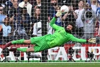 Goalkeeper Alisson Becker was Liverpools hero in the FA Cup final penalty shootout. AFP