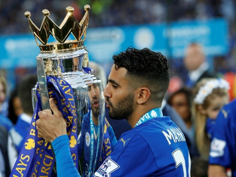 Leicester City's Riyad Mahrez poses with the Premier League trophy. AFP