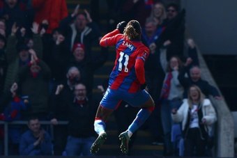 Wilfried Zaha jumps for joy as Crystal Palace reached the FA Cup semi-finals. AFP