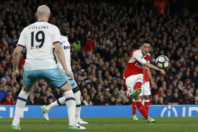 Ozil the difference to ease pressure on Wenger