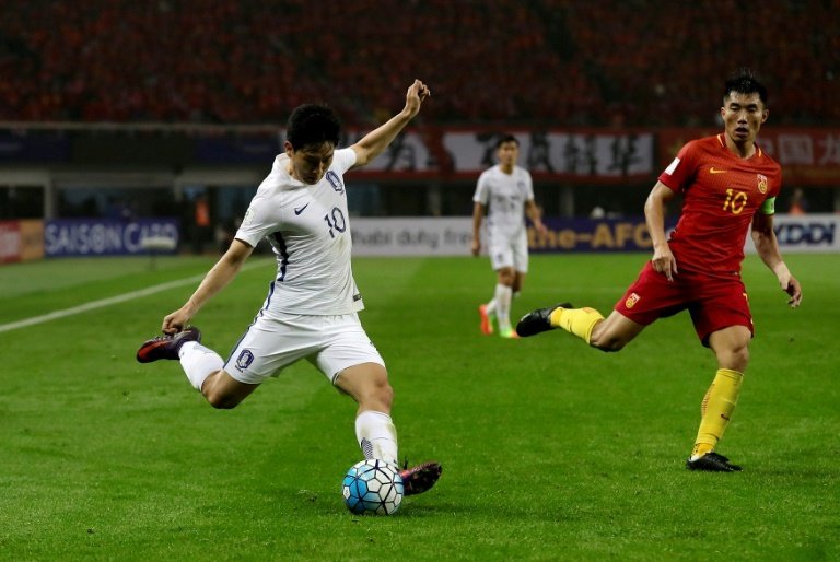 China stun Koreans to keep World Cup hopes alive