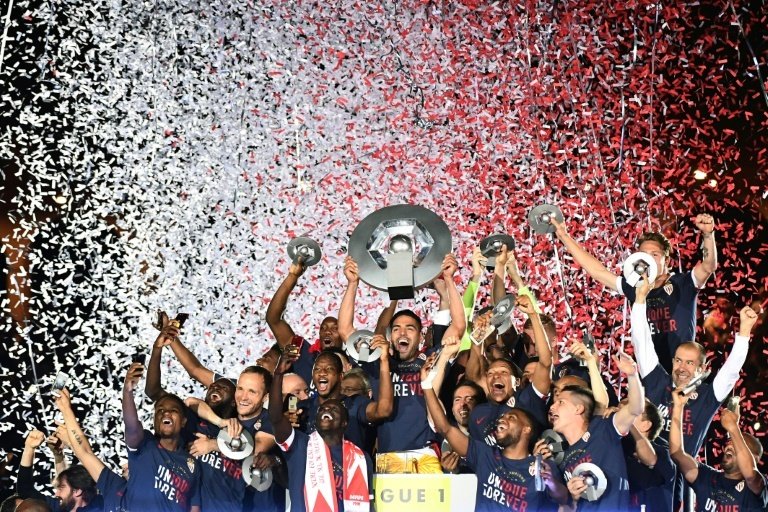 Monaco players celebrate at the end of their last French. AFP