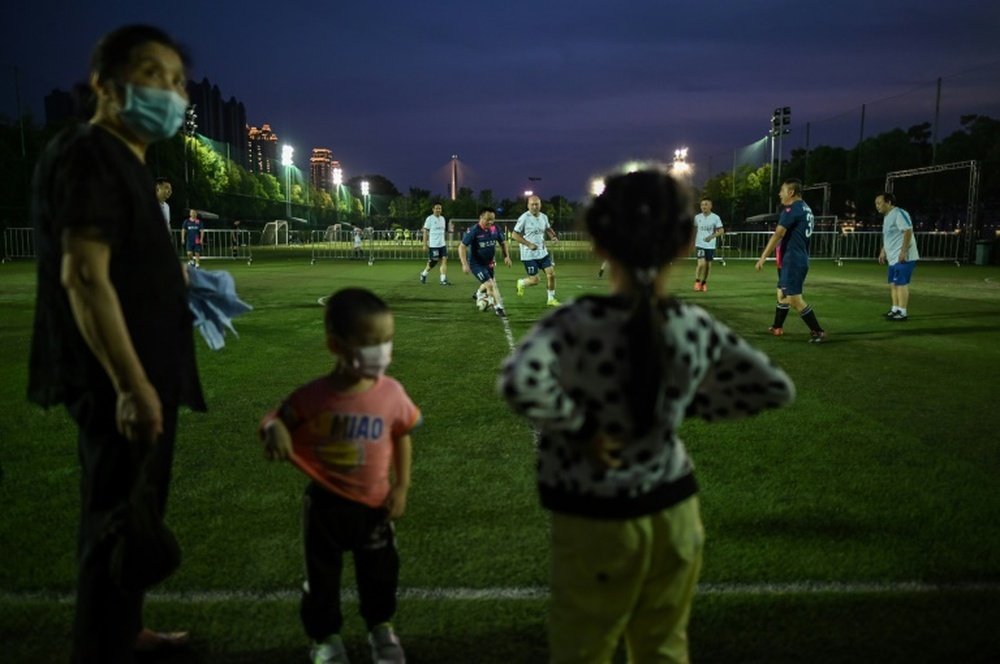 People can finally play football in Wuhan after COVID-19 restrictions were eased. AFP