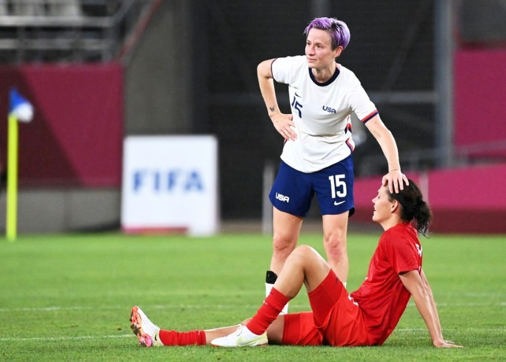 Megan Rapinoe (C) did not give anything away on her future. AFP