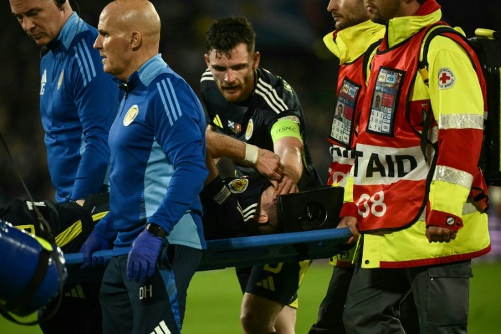Kieran Tierney had to be taken off on a stretcher in Scotlands draw with Switzerland. AFP