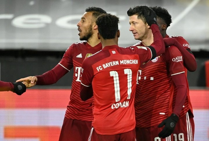 Lewandowski nets double as Bayern down Dortmund