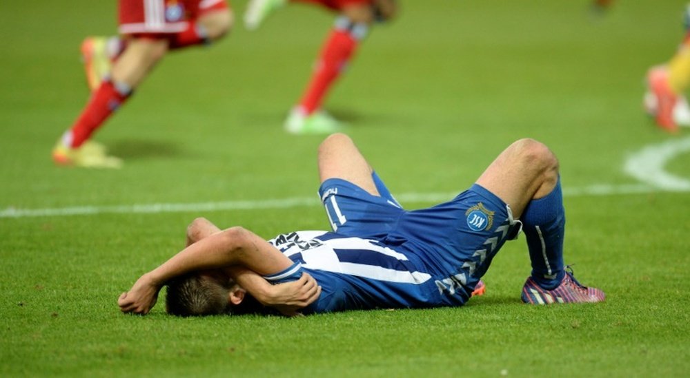 Dimitrij Nazarov hugged manager after nearly getting seriously injured on way to the game. AFP
