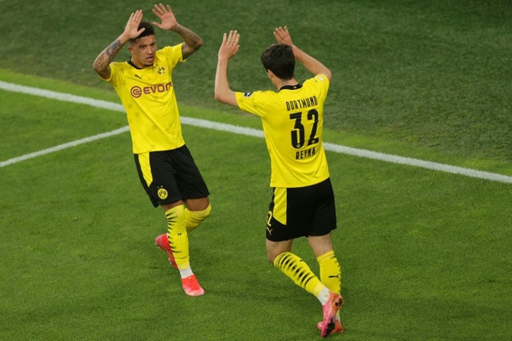 Giovanni Reyna (R) scored twice as Dortmund beat Kiel 5-0. AFP