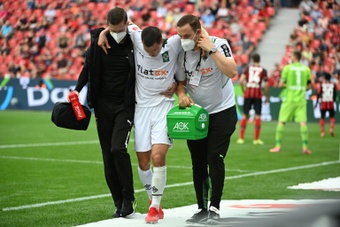 Stefan Lainer suffered a broken leg in the defeat at Bayer Leverkusen. AFP