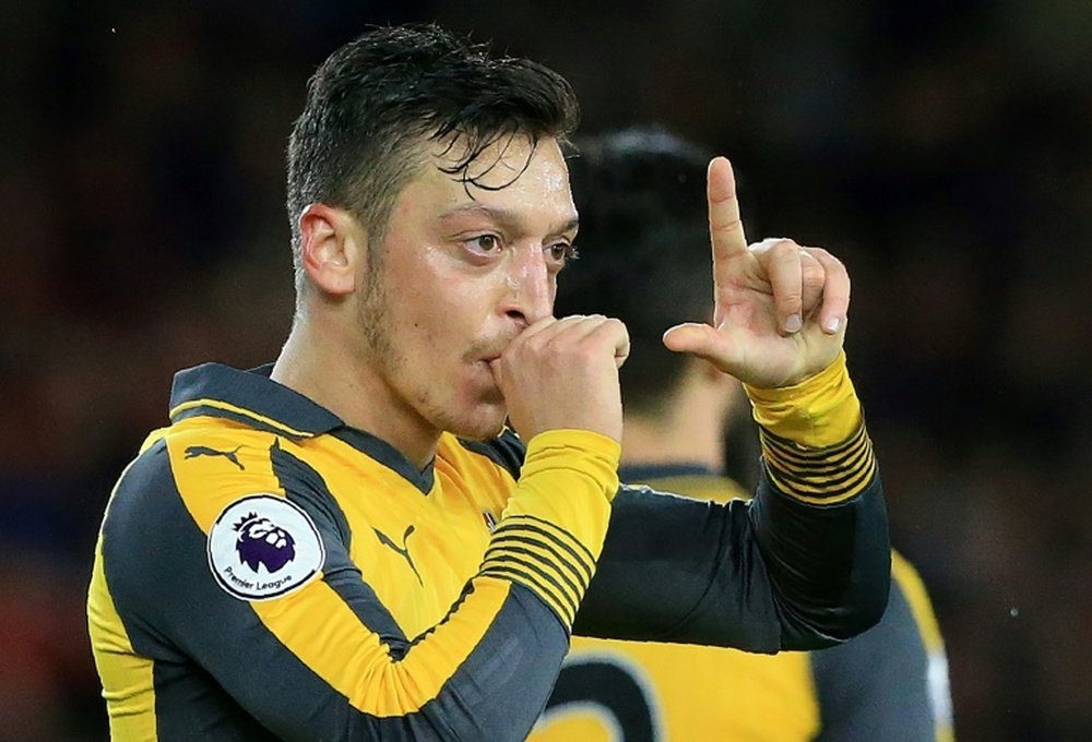 Arsenals midfielder Mesut Ozil celebrates scoring. AFP