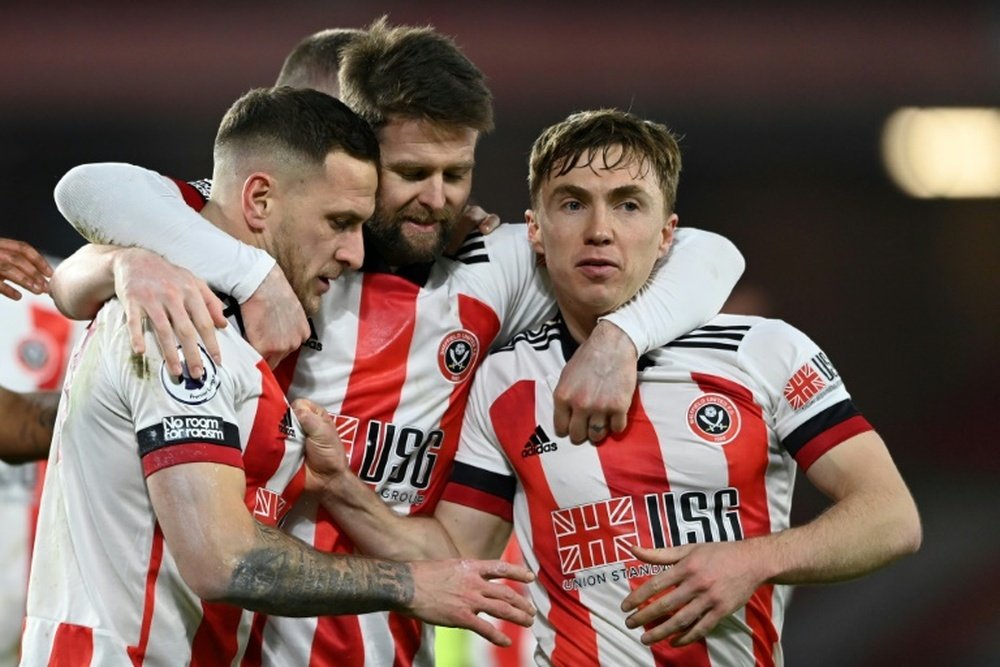 Sheff Utd won their first PL game of the season thanks to Billy Sharp (L). AFP