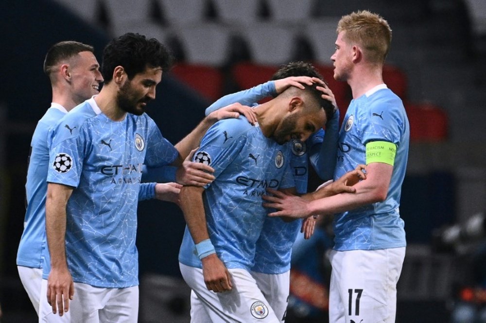 Man City came from behind as they beat 10 man PSG 1-2. AFP