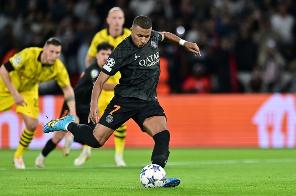 Mbappe breaks down Borussia Dortmund wall. AFP