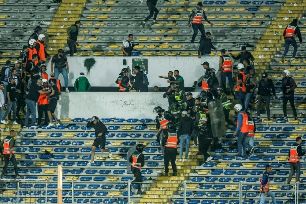 Police intervened among Raja fans during the CAF Champions League quarter-final football match. AFP