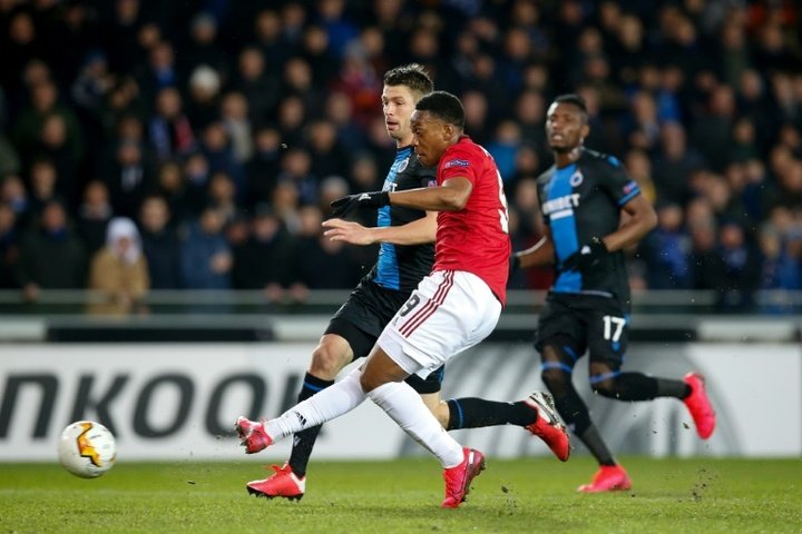 Martial grabs key goal for United in Belgium