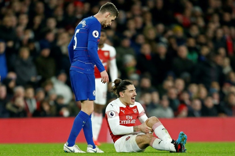 Arsenal defender Hector Bellerin reacts after picking up a knee injury against Chelsea. AFP