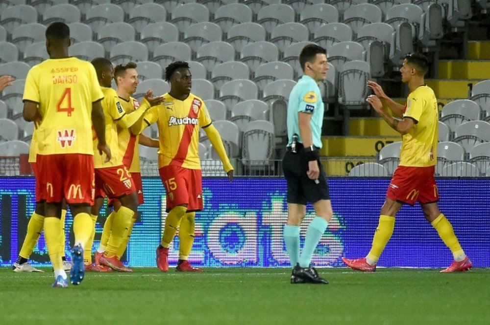 Lens cut PSG lead to six points in empty stadium. AFP