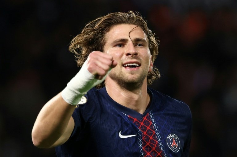 Injury-hit Paris Saint-Germain warmed up for a Champions League showdown with Barcelona by easing to a 2-0 win over Auxerre on Saturday which took them back to the top of the Ligue 1 table.