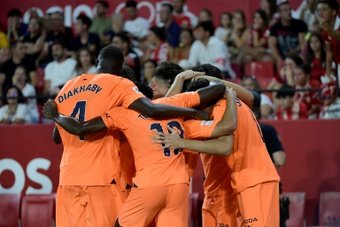 Valencia defeated Europa League champions Sevilla 2-1 on Friday on the opening night of the new Spanish Liga season.