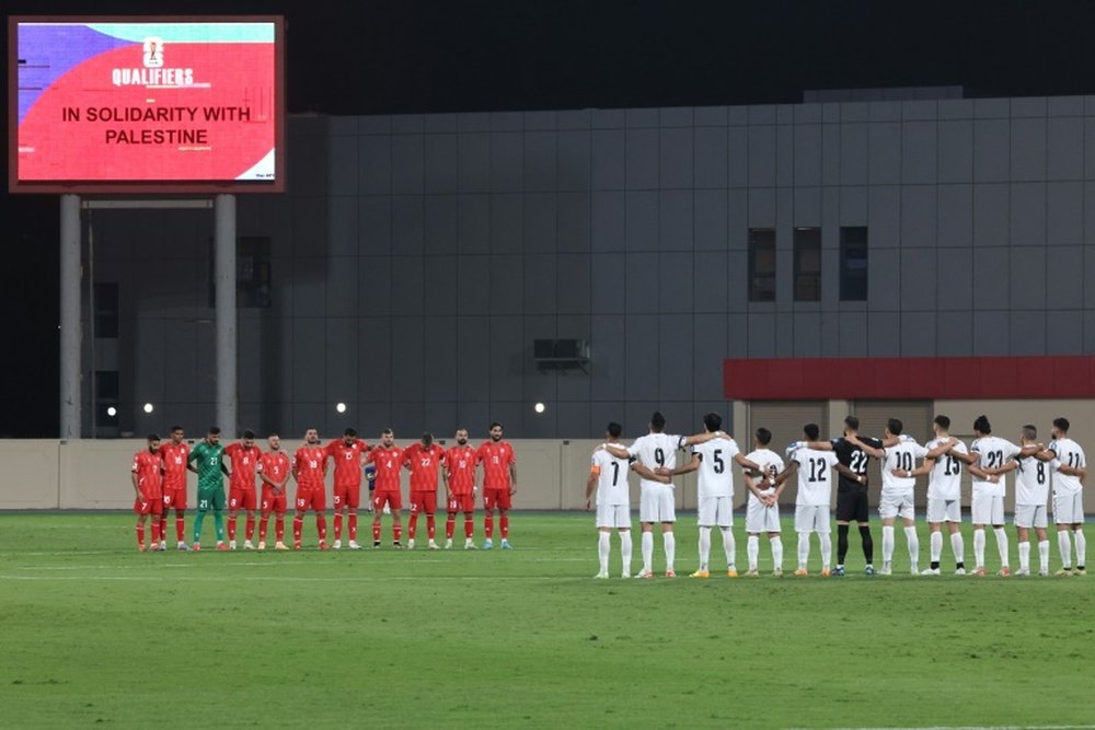 They hold a moments silence for the victims of the current conflict ahead of their qualifier. AFP