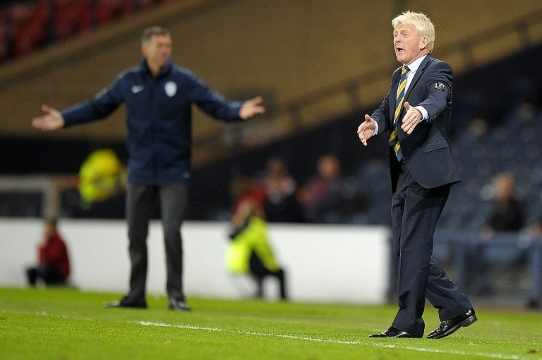 Football: Strachan calls for calm heads against England