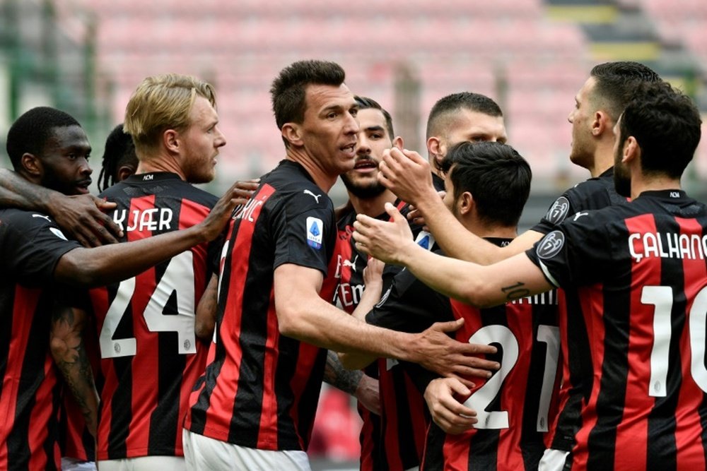 Mario Mandzukic (C) played as AC Milan beat Genoa. AFP