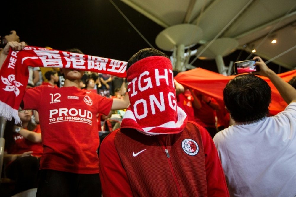 Hong Kong football fans have a history of covering their faces or booing national anthem. AFP