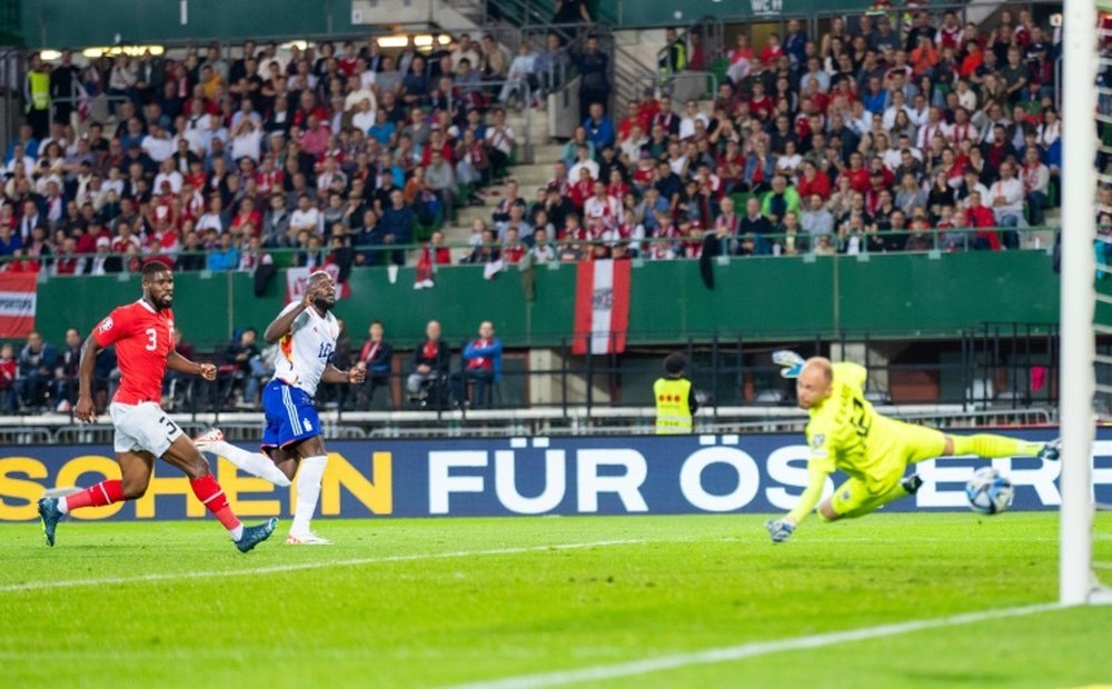 Lukaku (C) hits Belgiums third past Austria goalkeeper Alexander Schlager. AFP