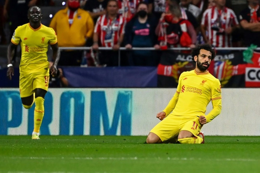 Mohamed Salah (R) scored the decisive goal in a cracking game with Atletico Madrid. AFP