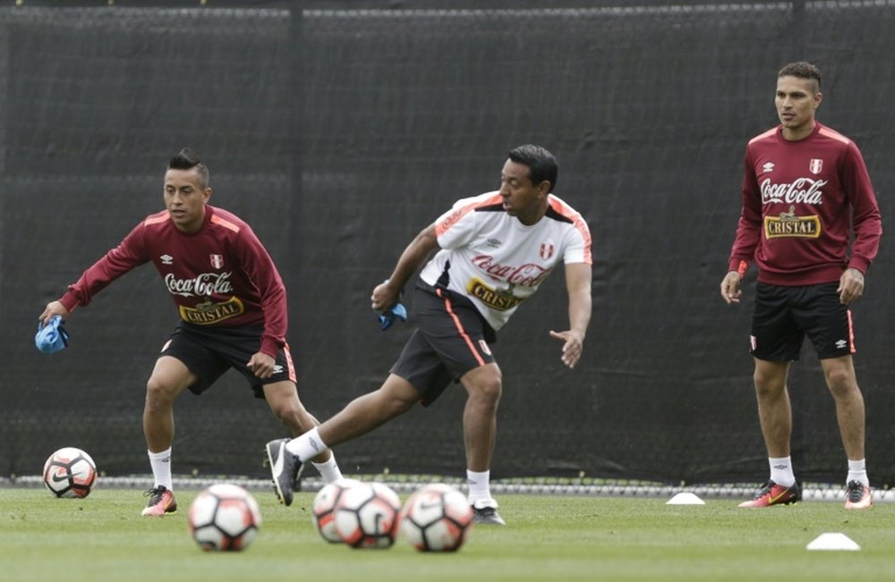 Nolberto Solano (middle) was arrested for not staying in his own home in Peru. AFP