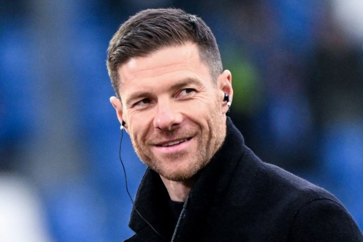 Xabi Alonso had been strongly linked to Liverpool but says he is staying at Leverkusen. AFP