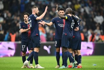 Paris Saint-Germain overcame a controversial first-half sending-off to win 2-0 away to bitter rivals Marseille in Ligue 1 on Sunday, with Portuguese duo Vitinha and Goncalo Ramos scoring their goals.