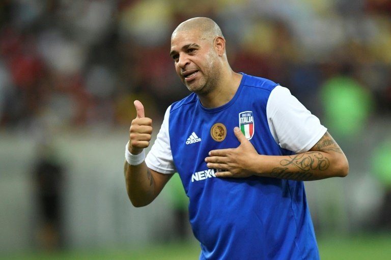 Former Brazil and Inter Milan striker Adriano, nicknamed the 'Emperor' in his prime, bid farewell to football on Sunday in a testimonial match at the home of Flamengo, the club where his once promising career started.