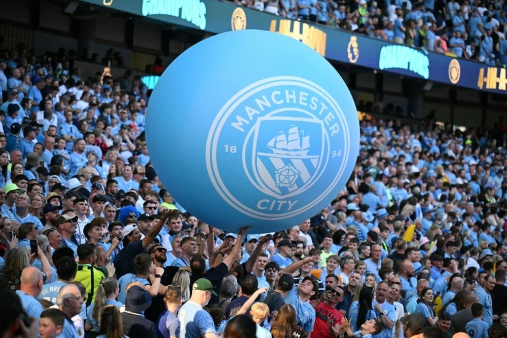 Manchester City fans are celebrating a fourth straight Premier League title. AFP