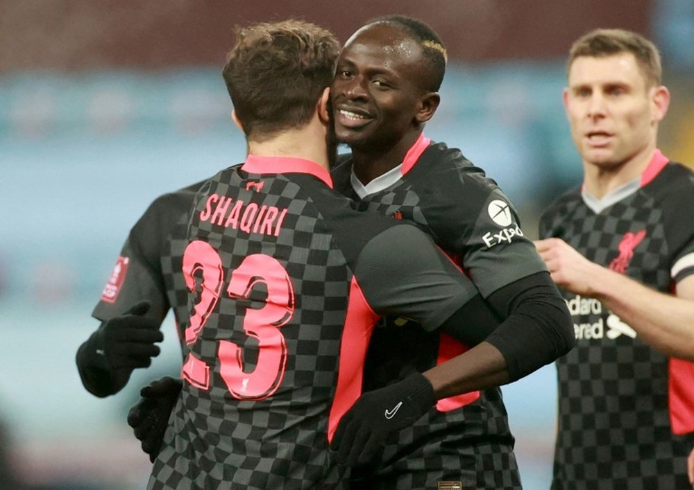 Liverpools Sadio Mane (C) celebrates scoring against Aston Villa. AFP