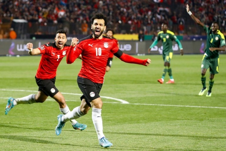 Liverpool star Mohamed Salah set up the equaliser for Egypt in a 2-1 win over Guinea on Wednesday that secured a place at the 2023 Africa Cup of Nations finals.