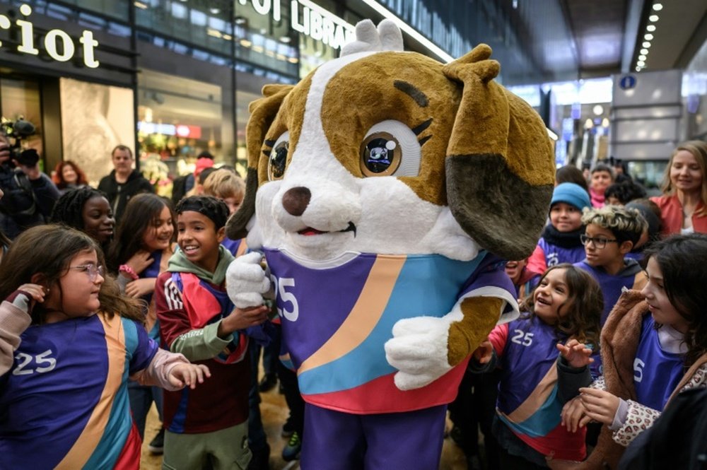 Children gathered around the Euro 2025 mascot Maddli in Switzerland. AFP