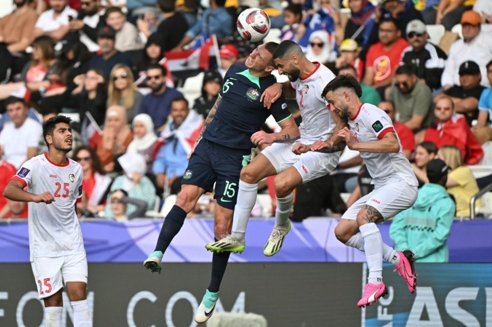 Australia followed hosts and holders Qatar into the last 16. AFP