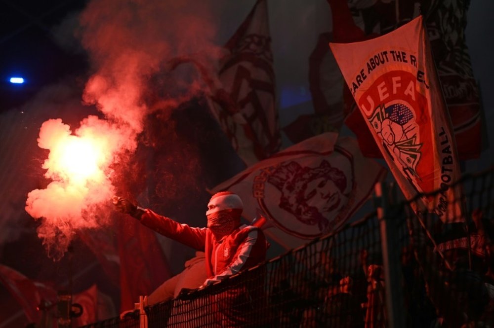 Bayern has been given a suspended ban on purchasing tickets in the away block. AFP