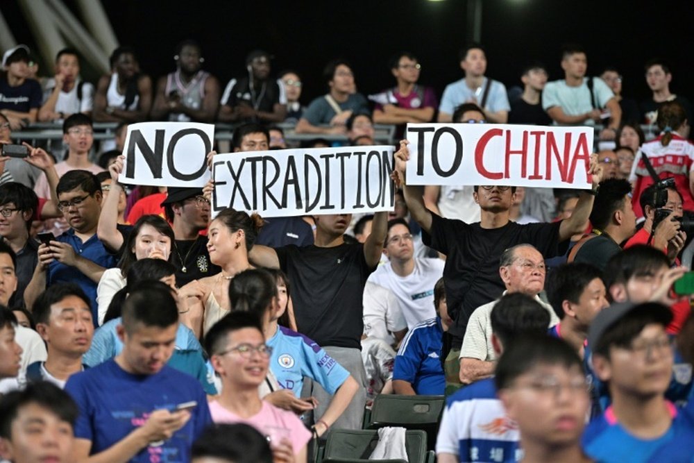 Hong Kong demonstrators unfurled banners and sang a protest song during the match. AFP