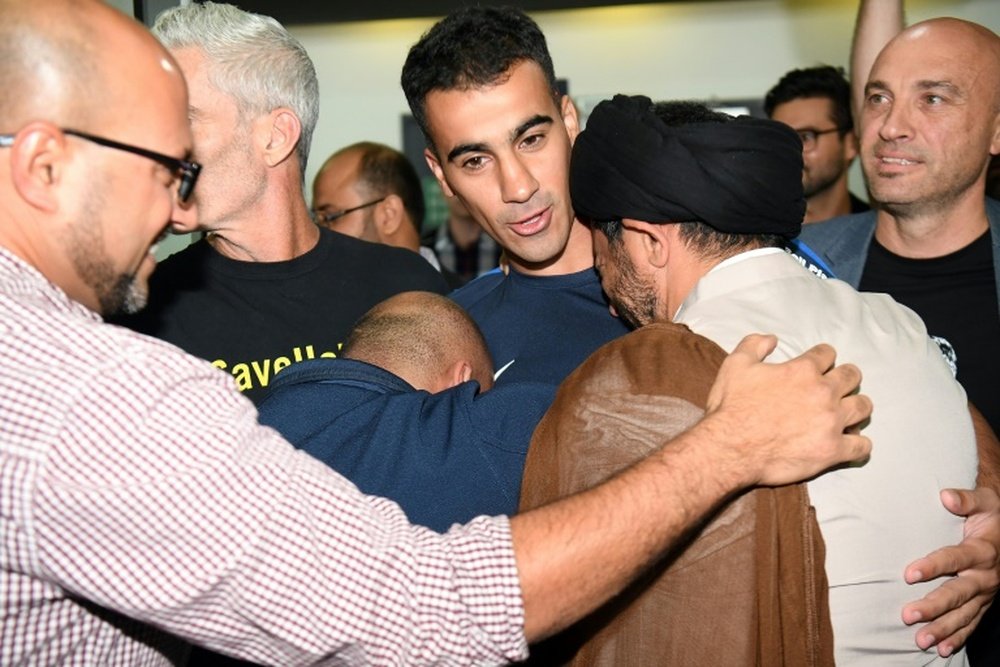 Refugee footballer makes triumphant return to Australia