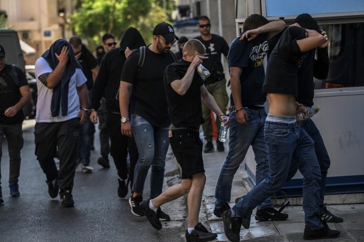 Thirty-five more people charged after fatal Athens stabbing of football fan
