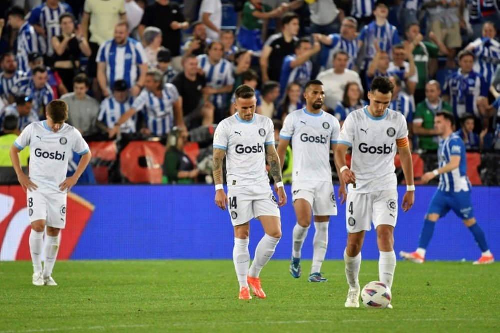 Girona players were disappointed after Jon Guridi's late equaliser for Deportivo Alaves. AFP