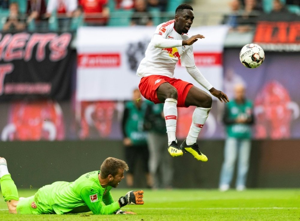 Jean-Kevin Augustin (R) was caught using his phone before a Europa league match. AFP