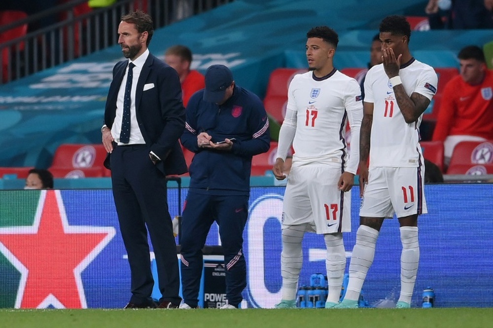 Gareth Southgate (L) got abuse after calling for young people to get vaccinated. AFP