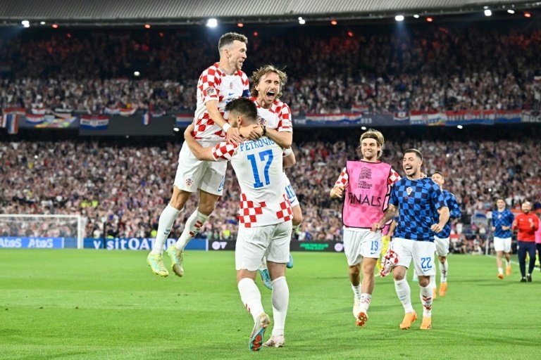 Perisic (L) thinks the team's experience could count against Spain's younger side. AFP