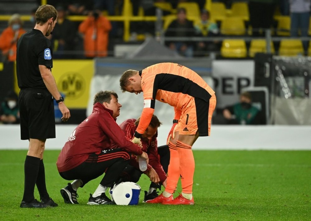 Neuer received treatment after the match against Dortmund. AFP