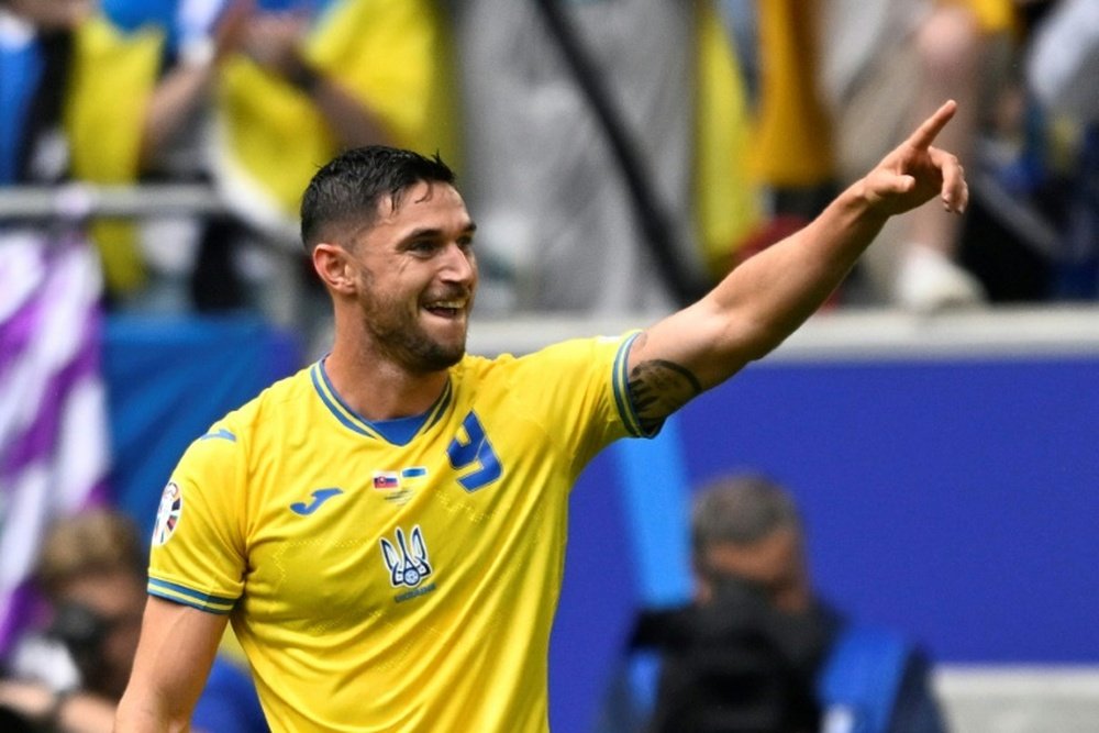 Roman Yaremchuk celebrates scored Ukraine's winning goal against Slovakia. AFP