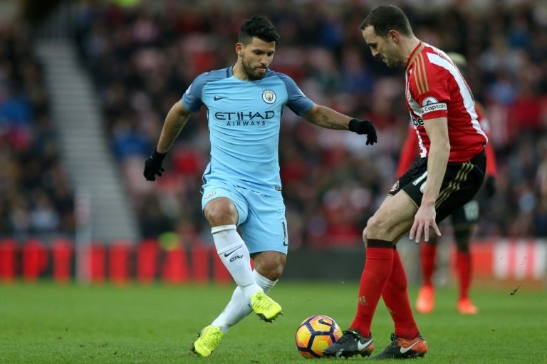 Sergio Aguero vies with Sunderlands defender John O'Shea. AFP